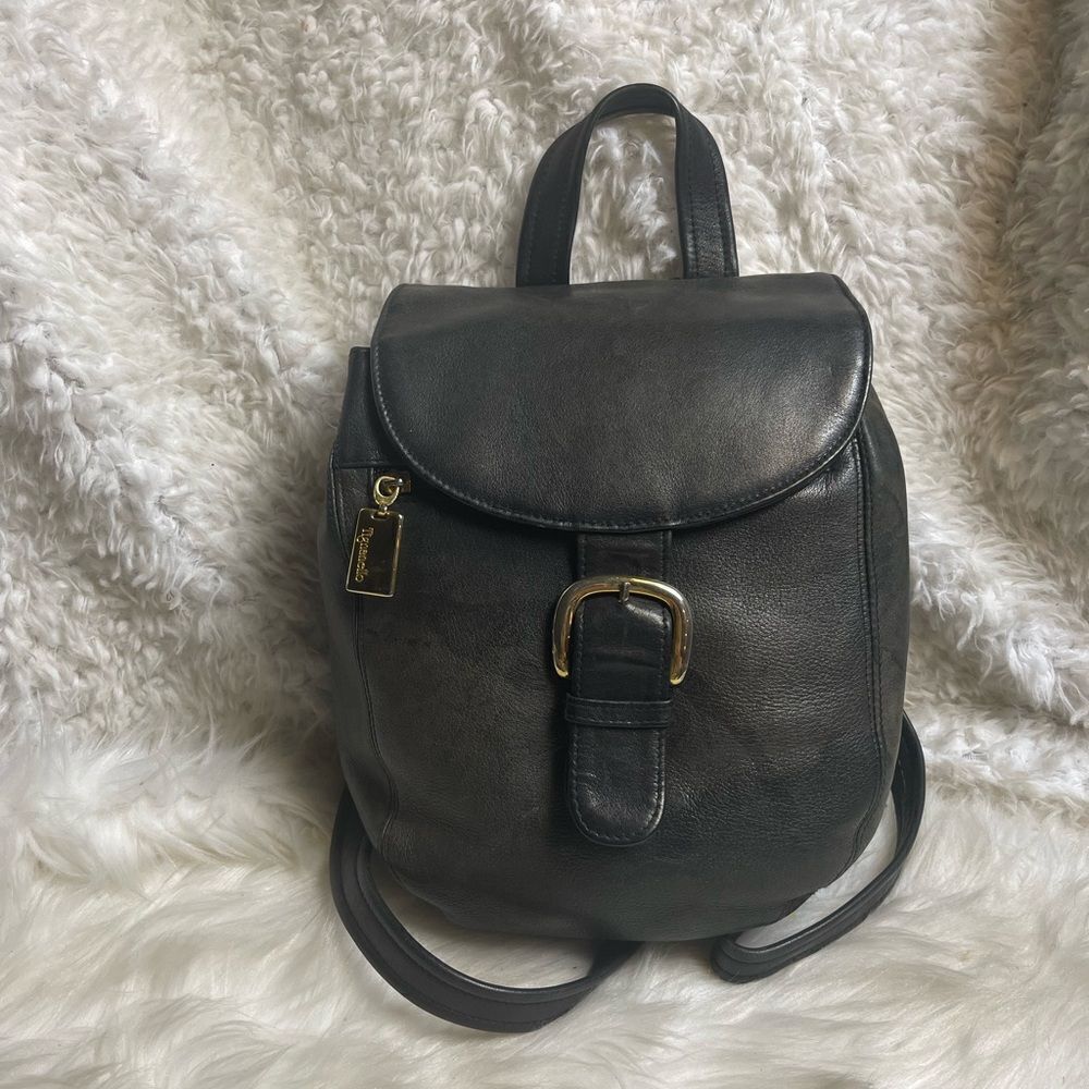 Tignanello leather black small backpack/ sling back with gold tone hardwares.